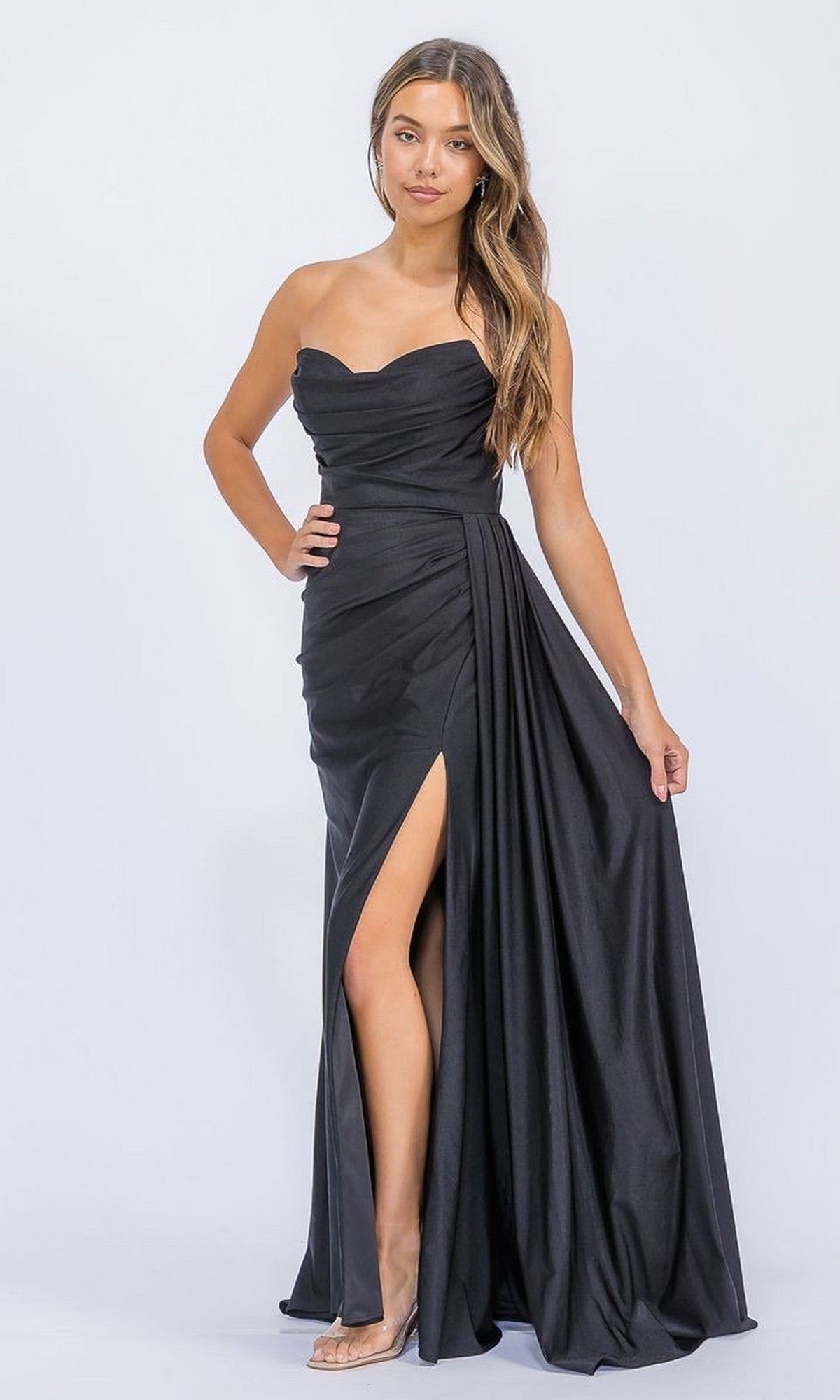 A woman models the Long Prom Dress: Eureka EK178, featuring a strapless sweetheart neckline, draped fabric, and a high leg slit, posed against a plain light background.
